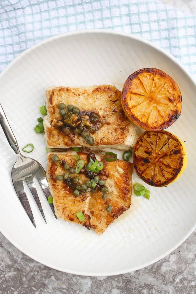 Fish Meunière (fish in butter sauce) with halibut on a plate.