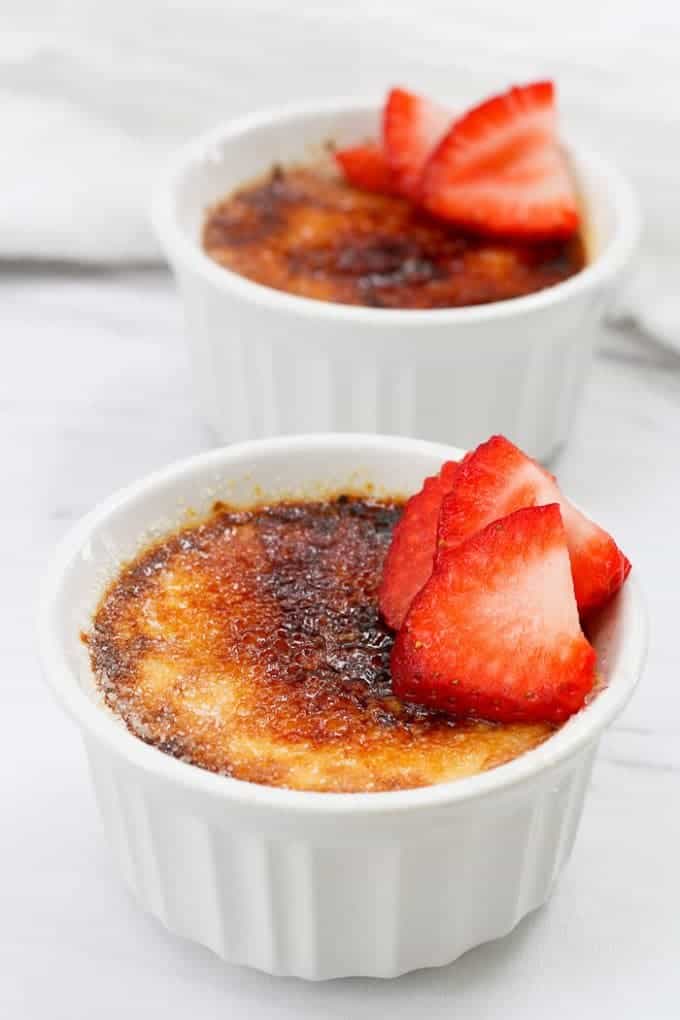 Breakfast Crème Brûlée in Small Ramekins with Strawberries on Top