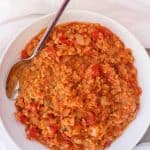This vegan Red Lentil Dal is an easy and delicious spiced red lentil dish.  It can be served alone as a soup, or as a side dish along with rice.