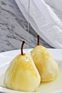 These Poached Pears with Cardamom are a light and delicious dessert of pears poached in a spiced white wine.
