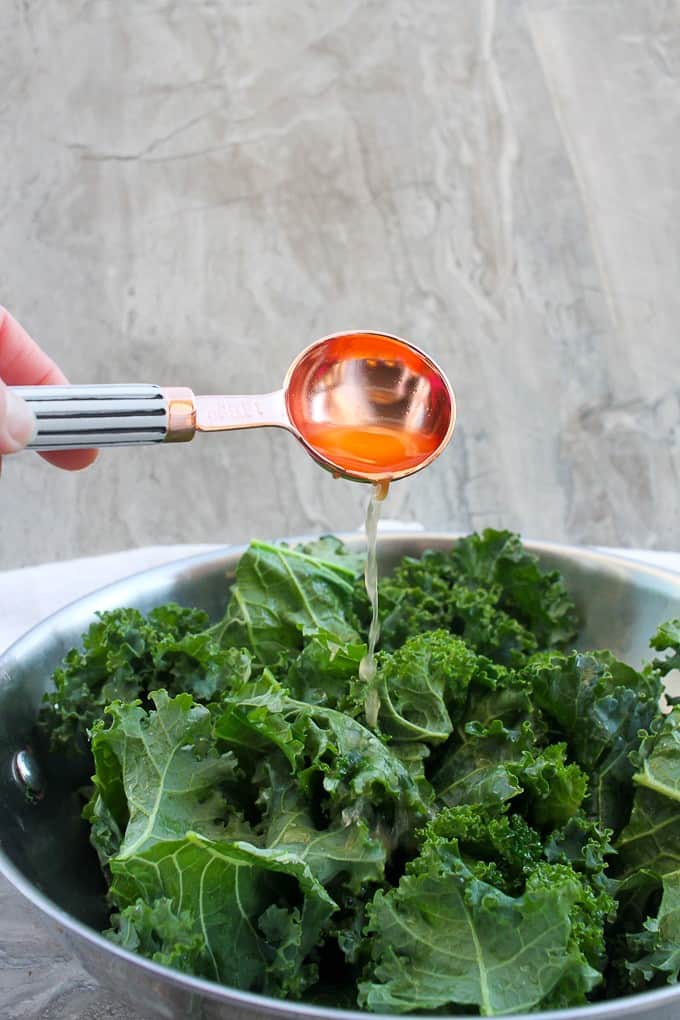 Pouring vinegar over the kale