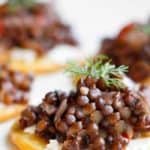 These vegan-friendly Beluga Lentil Caviar feature black beluga lentil salad served on top of crackers and cream cheese, and are the perfect cold weather appetizer for your dinner party!