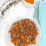 French Lentil Salad in a bowl with Dijon onFrench Lentils with Dijon Vinaigrette the side