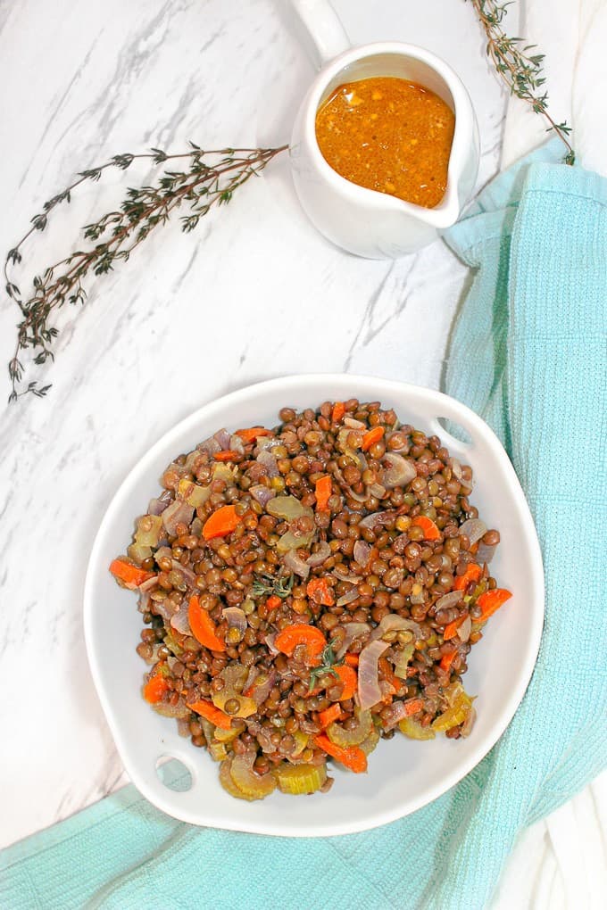 French Lentil Salad in a bowl with Dijon onFrench Lentils with Dijon Vinaigrette the side