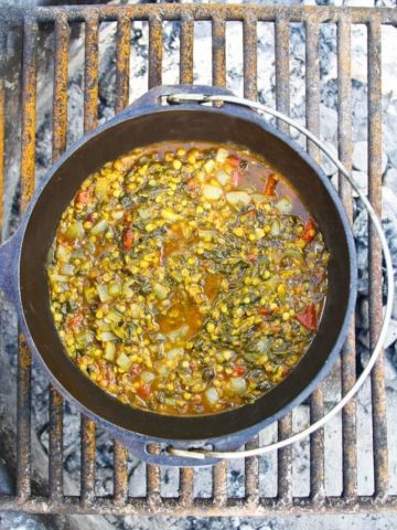 This easy vegan CAMPING Palak Dal (Red Lentils with Spinach) is cooked in a Dutch oven right on the campfire!