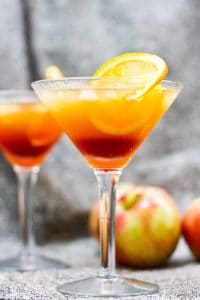 This Apple Cider Kentucky Sunrise is made with bourbon, apple cider, and pomegranate simple syrup. This southern twist on the classic Tequila Sunrise is the perfect fall cocktail.