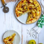 apple gorgonzola pizza with a slice cut out