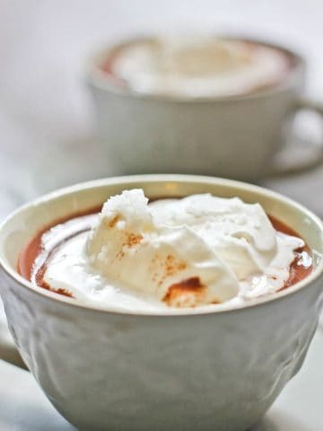 This decadent, vegan-friendly Salted French Hot Chocolate (Chocolat Chaud) is made with crushed chocolate, whole milk and cream (or coconut milk and coconut cream), and topped with flavorful gourmet salt. The salt for this recipe was provided by J.Q. Dickinson Salt-Works.