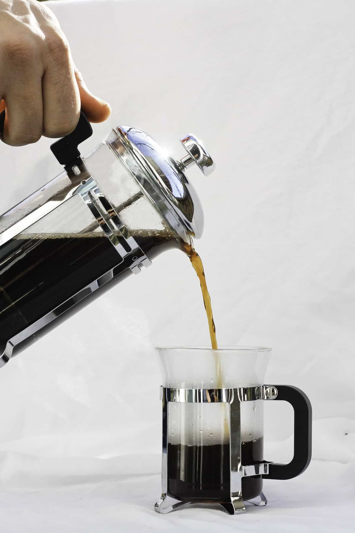 pouring coffee from a french press.