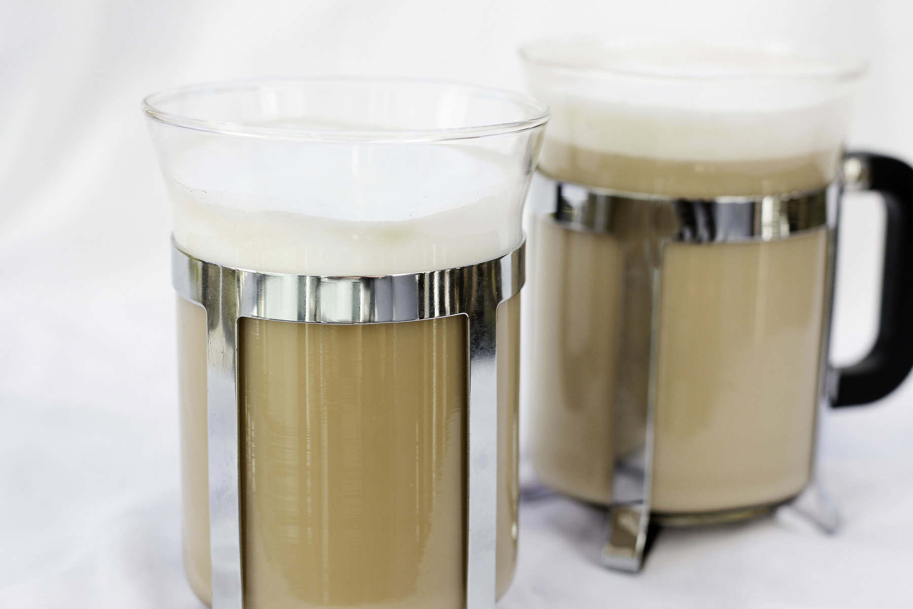 french press cappuccinos in glasses.