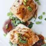 pan-seared cod with bourbon sauce on a plate