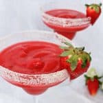 Strawberry rhubarb Margarita cocktail- an easy spring and summer cocktail made with frozen strawberries, rhubarb simple syrup, tequila, and triple sec.