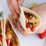 These Strawberry Rhubarb Tilapia Tacos are filled with a strawberry cole slaw, sweetened rhubarb, and ginger seared tilapia.