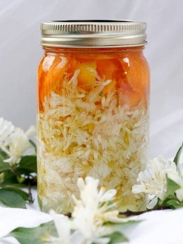This honeysuckle season, try preserving the edible flowers by infusing them into a deliciously sweet and floral Honeysuckle Vodka. champagne-tastes.com