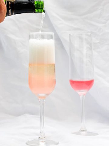 This Rhubarb Champagne is a springtime take on a mimosa, and is made with sparkling wine or champagne and rhubarb simple syrup.