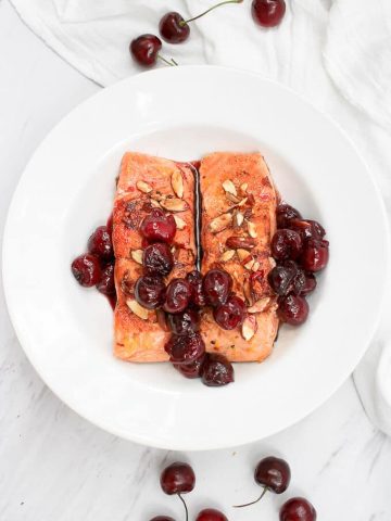 This Almond Cherry Seared Salmon is the perfect date night centerpiece, and features rich king salmon seared to perfection and topped with hot, juicy cherries and toasted almonds.