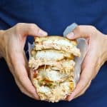 This Cod Reuben Sandwich is a fishy take on a classic deli-style reuben, and is piled high with seared cod, sauerkraut, and a homemade yogurt-based Russian dressing.