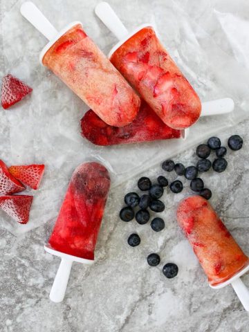 These easy two-ingredient Kombucha Popsicles are the perfect cool treat on a hot summer day! champagne-tastes.com