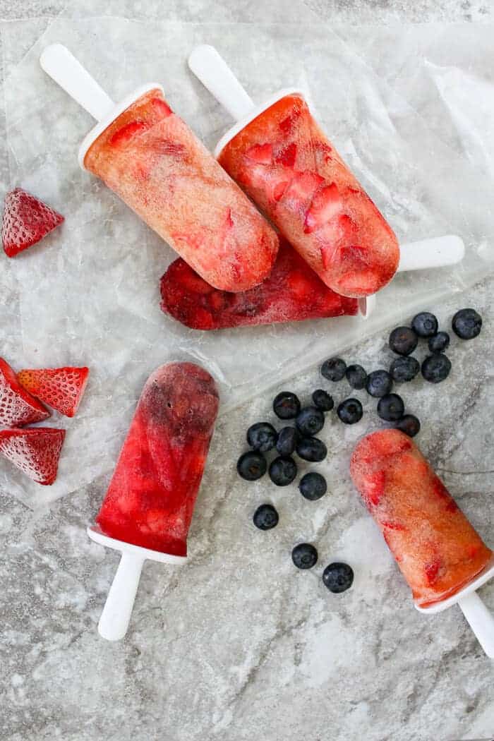 Kombucha Popsicles with blueberries and strawberries