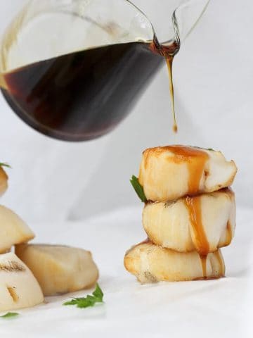 These Bourbon Grilled Scallops are cooked on skewers on the grill, and topped with an easy, sweet bourbon sauce!