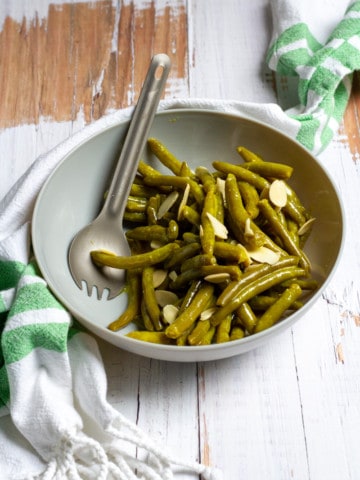 canned green bean salad in a serving bowl
