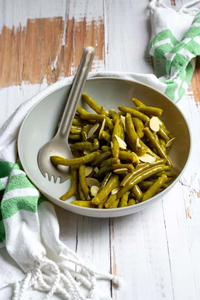 canned green bean salad in a serving bowl