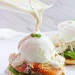 This Healthy Crab Eggs Benedict is made with Dungeness crab legs, a poached egg, and a creamy yogurt sauce, and is a lighter take on the breakfast classic!