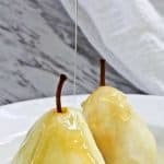 These Poached Pears with Cardamom are a light, delicious dessert of ripe pears poached in a spice-infused white wine syrup.