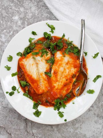 This easy Pumpkin Cod Curry is made with a spiced pumpkin and tomato sauce, fresh spinach, and gently poached cod.