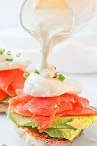 This Smoked Salmon Eggs Benedict is an Easy and Healthy Brunch Recipe.  It's made with smoked salmon, poached eggs, and a creamy yogurt sauce, and is a lighter take on the breakfast classic!