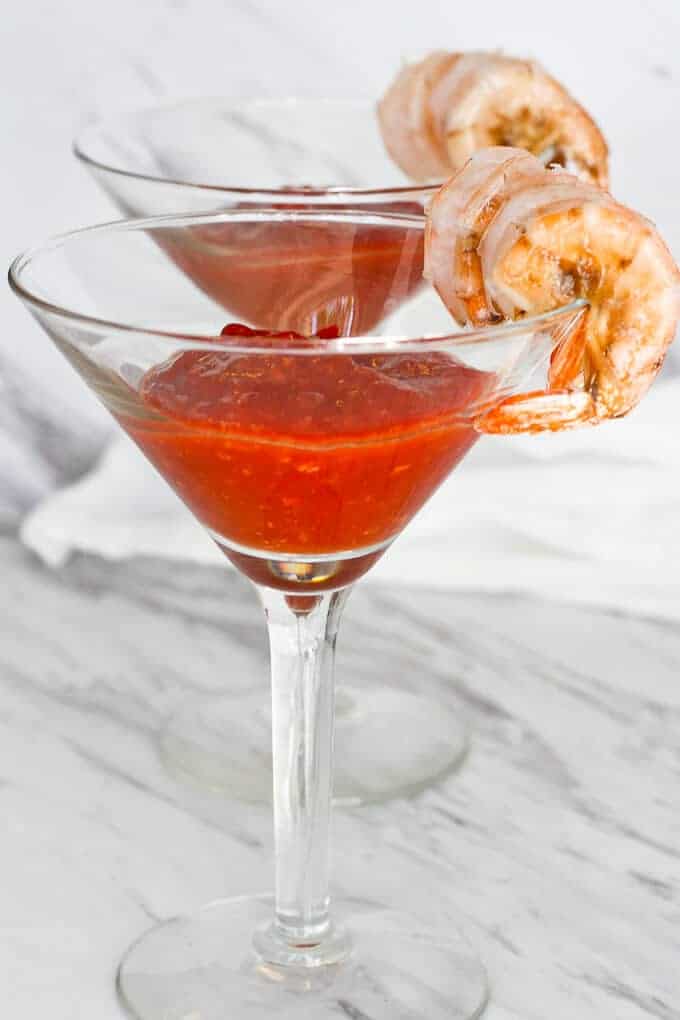 Shrimp Cocktail Served in Cocktail Glasses with the Sauce in the Glass and the Shrimp on the Glass Rim.