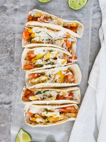 These Pineapple Shrimp Mini Tacos are filled with slightly spicy shrimp and diced pineapple, and topped with a creamy yogurt sauce. These tiny tacos are healthy, easy, and perfect for parties!