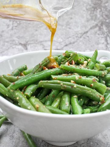 This Green Bean Salad with Almonds is made with fresh green beans, almonds, and an quick homemade honey mustard dressing.  Serve it warm or cold for an easy side dish!