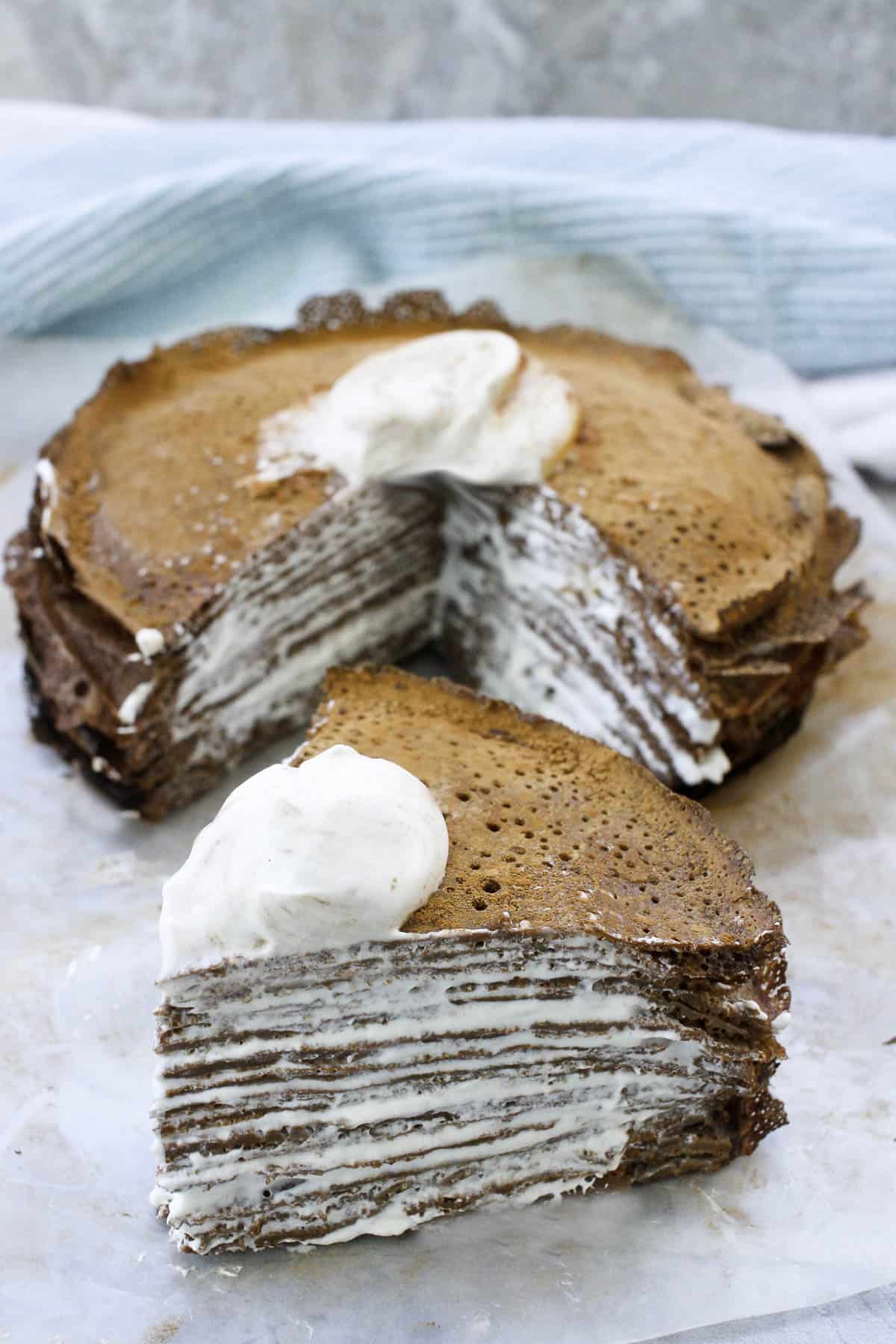 crepe cake with piece cut out.