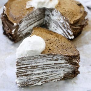 crepe cake with piece cut out.
