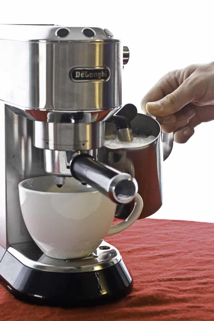 Frothing milk with an espresso maker.