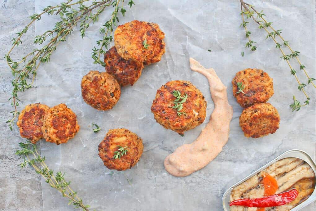 Sardine Fish Cakes in a stack with sauce on the serving tray