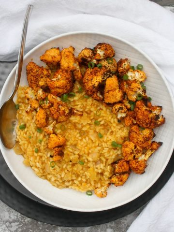 Lemon Risotto with Roasted Cauliflower in a serving bowl