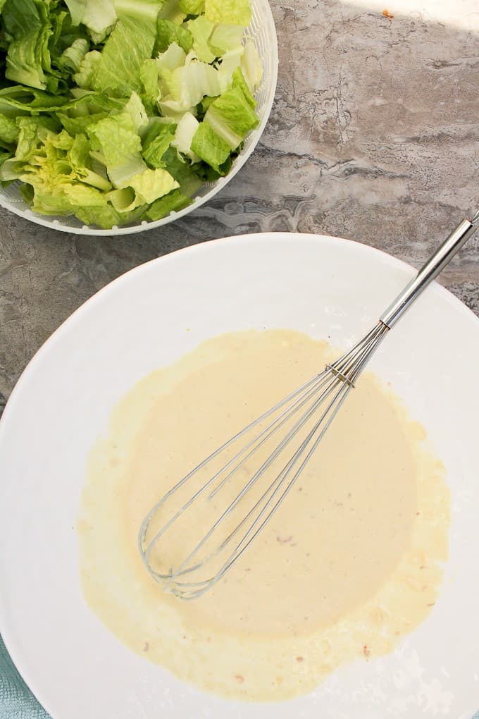 Whisking together the Caesar Dressing