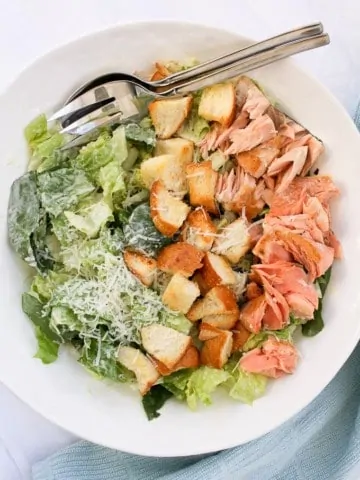 Salmon Caesar Salad in a serving bowl