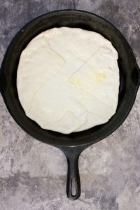 Fold the edges of the dough over