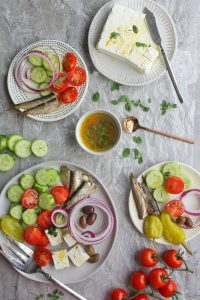 Greek salad without lettuce arranged onto plates