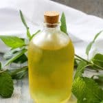 mint simple syrup in a bottle
