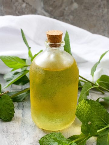 mint simple syrup in a bottle