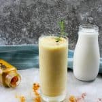 This easy, vegan friendly Turmeric Smoothie with Kefir is an ice cold Golden Milk Latte! Packed with probiotic kefir (or coconut milk kefir), anti inflammatory turmeric, and a little maple syrup-- this spiced lassi drink is a delicious and healthy option.