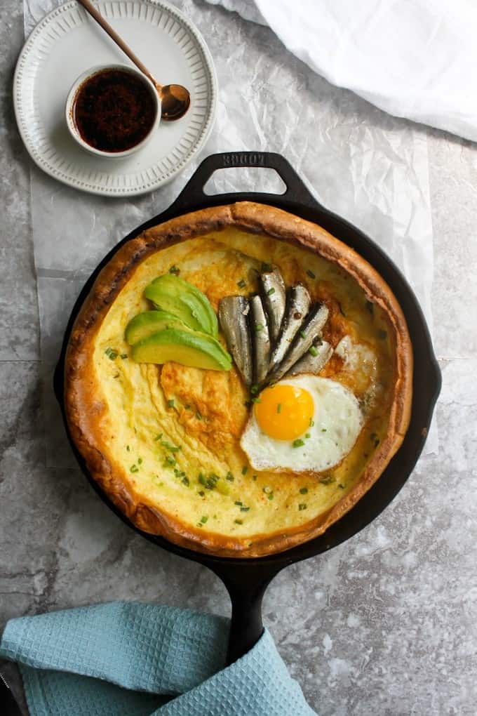 dutch baby korean seafood pancakes with sardines in a 10" lodge cast iron.