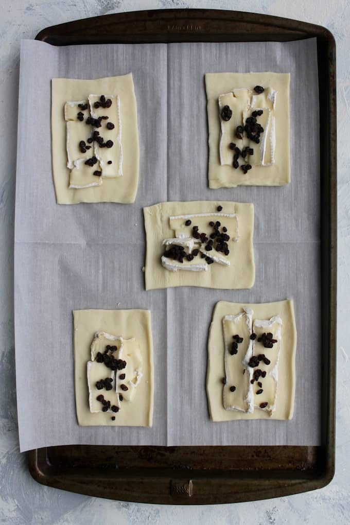 add brie and dried currants to the puff pastry