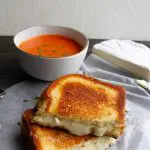 brie grilled cheese and a bowl of tomato soup