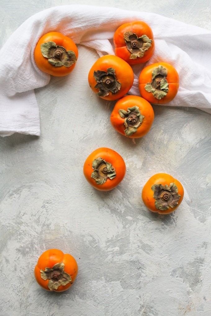 persimmons on a countertop