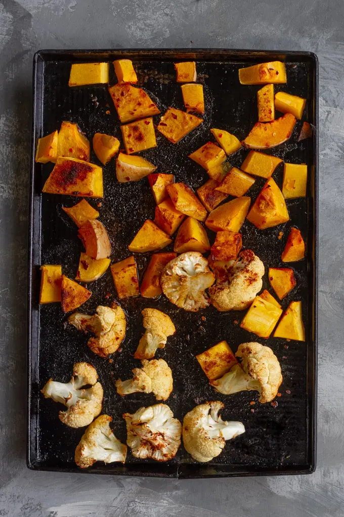 roasted butternut squash and cauliflower on a serving tray